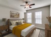Thumbnail 15 of 42 - a bedroom with a bed and a ceiling fan