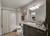 Thumbnail 42 of 42 - our apartments offer a bathroom with a shower and a sink