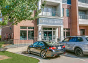 Thumbnail 34 of 42 - two cars parked in front of a fitness center