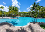 Thumbnail 3 of 44 - a swimming pool at a resort with palm trees