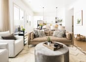 Thumbnail 18 of 30 - a living room with white walls and a brown couch