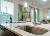Thumbnail 5 of 33 - a kitchen with a sink and a window