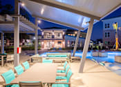Thumbnail 31 of 33 - underneath the patio night time pool view