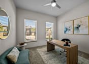 Thumbnail 5 of 36 - A room with a desk, chair, and a round mirror on the wall.