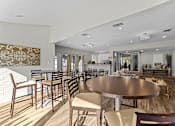 Thumbnail 16 of 17 - A modern dining room with a large table and chairs.
