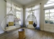 Thumbnail 4 of 20 - two hanging hammock chairs in a living room