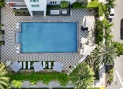 Thumbnail 47 of 66 - an aerial view of a swimming pool in a hotel with palm trees