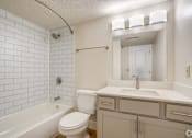 Thumbnail 4 of 44 - a bathroom with a sink toilet and a tub