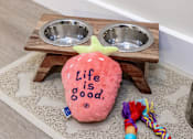 Thumbnail 29 of 44 - A pink dog bed with the words "Life is good" on it.