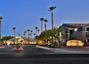 Thumbnail 12 of 16 - A street view of a residential area with palm trees and a sign that reads "Villagio.".