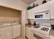 Thumbnail 17 of 25 - Two Bedroom Kitchen with Laundry at The Sanctuary of Lake Villa, Lake Villa, IL