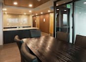 Thumbnail 30 of 50 - A conference room with a long table and chairs at Denver Metro Village Apartments, Denver, 80204