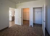 Thumbnail 46 of 50 - A room with a carpeted floor and a white door at Denver Metro Village Apartments, Denver, CO, 80204
