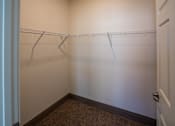 Thumbnail 43 of 50 - A white door with a handle and a white wall with a shelf at Denver Metro Village Apartments, Colorado, 80204