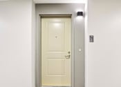 Thumbnail 14 of 42 - A white door with a silver frame is closed.
