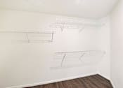 Thumbnail 42 of 42 - Empty white shelves on the wall.