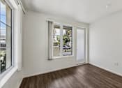 Thumbnail 6 of 42 - A room with a window and a door is shown.