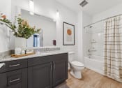 Thumbnail 9 of 38 - a bathroom with a shower toilet and sink and a mirror  at Plat 4 at Research Triangle, Durham, NC, 27703