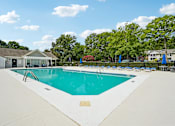 Thumbnail 8 of 107 - A large swimming pool with a white fence around it.