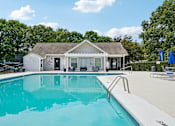 Thumbnail 2 of 107 - A swimming pool in front of a house.