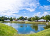 Thumbnail 3 of 37 - lake view with grass at Shady Oak Village - Senior Living Apartments, IN, 47802