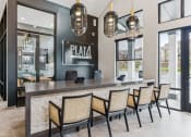 Thumbnail 23 of 38 - the lobby of a restaurant with a bar and chairs at Plat 4 at Research Triangle, Durham