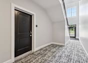 Thumbnail 16 of 53 - Interior hallway with unit entry at Nook Nine Apartments