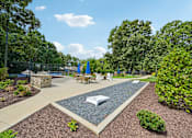 Thumbnail 97 of 107 - A park with a playground and picnic tables.