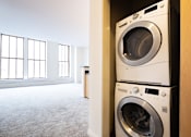 Thumbnail 15 of 32 - a washer and dryer in a laundry room at 26 West, Managed by Buckingham Urban Living, Indianapolis
