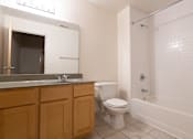 Thumbnail 27 of 32 - a bathroom with a toilet sink and bathtub at 26 West, Managed by Buckingham Urban Living, Indianapolis