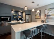 Thumbnail 37 of 49 - Gourmet Kitchen With Island at The Summit at Avent Ferry, Raleigh