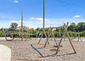 Thumbnail 25 of 28 - Rope climbing playground and wooden swing set at Nook Nine community