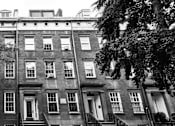 Thumbnail 1 of 18 - a large brick building with trees in front of it