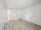 Thumbnail 80 of 107 - A room with carpeted floor and white walls.