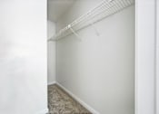 Thumbnail 59 of 107 - A white wall with a white shelf above it.