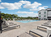 Thumbnail 45 of 53 - Swimming pool with lounge chairs at Nook Nine Apartments