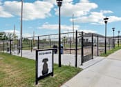 Thumbnail 42 of 53 - Fenced dog park with sign at Nook Nine Apartments in Northside Indianapolis