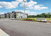 Thumbnail 41 of 53 - Exterior of Nook Nine Apartments with landscaped entry on Far Northside Indianapolis