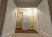 Thumbnail 15 of 18 - a small laundry room with a washer and dryer in it at The Ambassador at Library Square, Indianapolis, IN, 46204