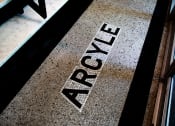Thumbnail 19 of 35 - Mosaic tile of Argyle building name on building entry floor at The Argyle on Mass Ave, Indiana
