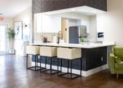 Thumbnail 12 of 38 - Large Island Kitchen With Custom Cabinetry at Bradford Ridge Apartments, Bloomington