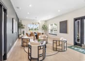 Thumbnail 21 of 37 - A modern living room with a black and white color scheme.