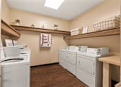 Thumbnail 23 of 36 - Community laundry room at Heritage Trail Apartments in Terre Haute, IN.
