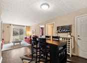 Thumbnail 4 of 36 - Open living room to dining room at Heritage Trail Apartments in Terre Haute, IN.