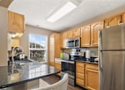 Thumbnail 1 of 36 - Kitchen with beautiful sunlight at Heritage Trail Apartments in Terre Haute, IN.
