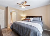 Thumbnail 11 of 36 - Bedroom with ceiling fan at Heritage Trail Apartments in Terre Haute, IN.