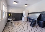 Thumbnail 16 of 33 - a kitchen with a sink and a refrigerator and a table