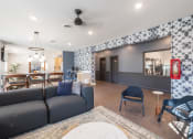 Thumbnail 8 of 33 - a living room and dining room with a couch and a table