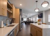 Thumbnail 4 of 33 - a kitchen with a large counter top and a sink