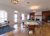 Thumbnail 11 of 33 - an open living room and dining room with a table and chairs
